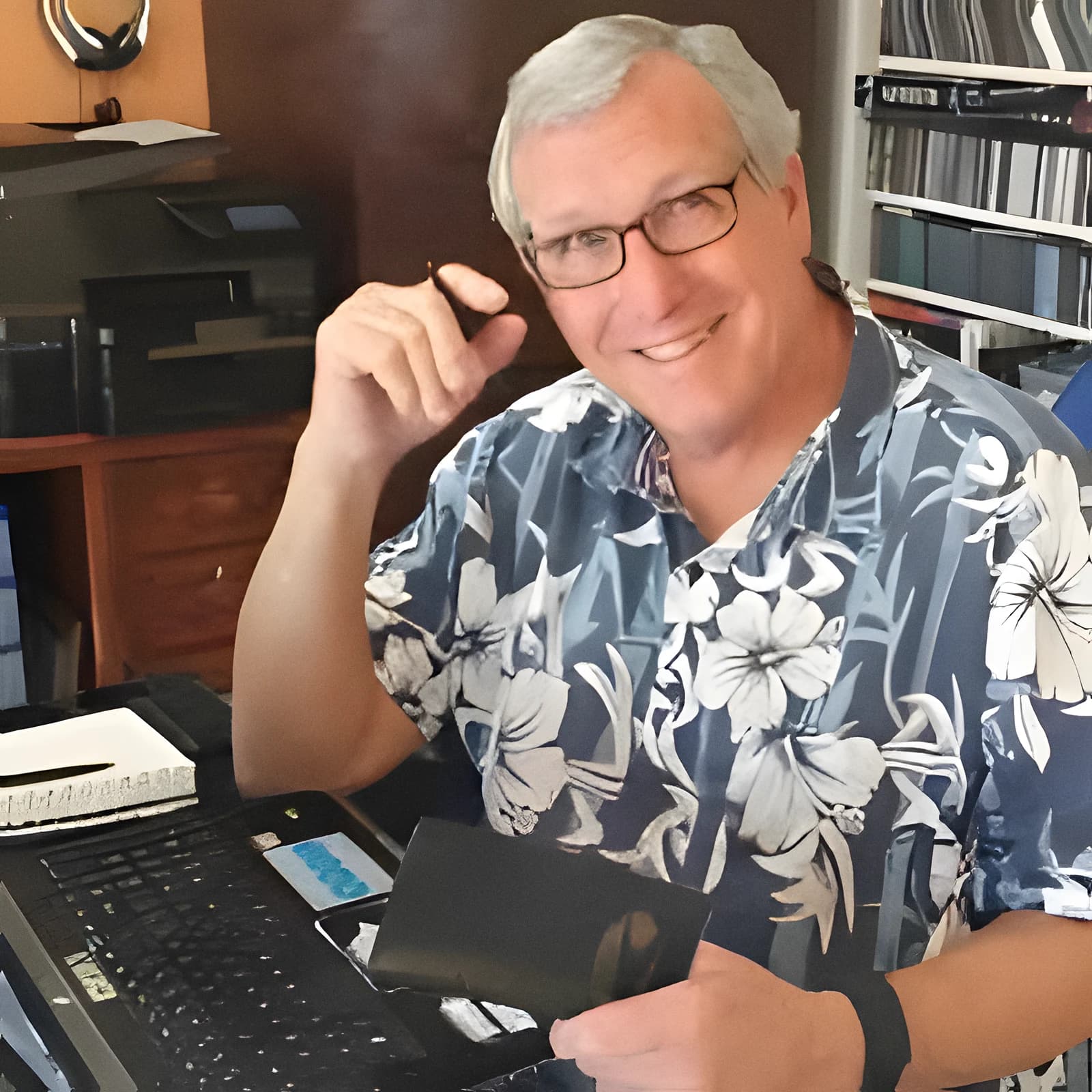 Brice Boucher, founder of Shower Garde, smiling at his desk.